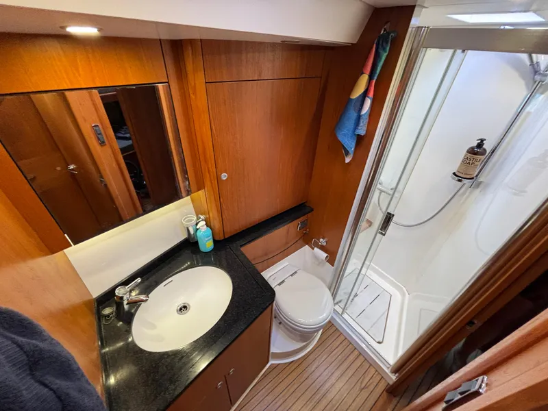 Slide: The Image of Luxurious bathroom in 2014 Southerly 535 yacht with shower, sink, and toilet. - 23