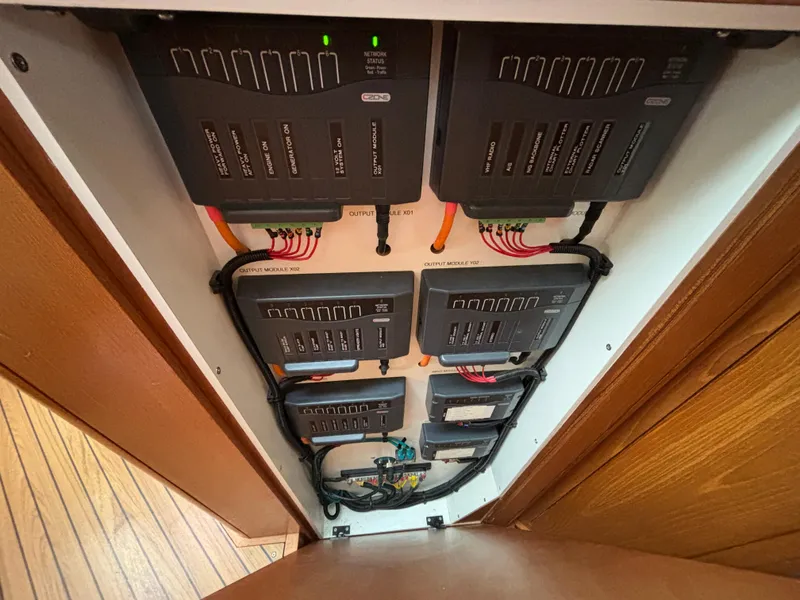 Slide: The Image of Electrical panel of a 2014 Southerly 535 yacht, showcasing wiring and modules. - 26