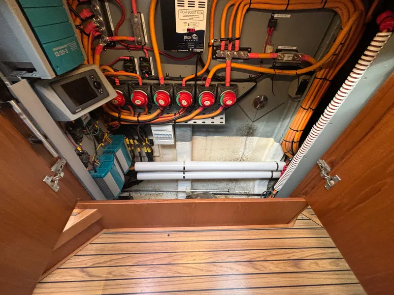 Slide: The Image of Electrical panel of a 2014 Southerly 535 yacht, featuring wiring and control systems. - 27