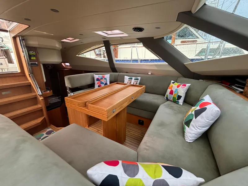 Slide: The Image of Luxurious interior of 2014 Southerly 535 yacht with cozy seating and colorful cushions. - 28