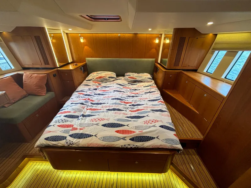Slide: The Image of Luxurious cabin interior of 2014 Southerly 535 yacht with cozy bed and wooden furnishings. - 3