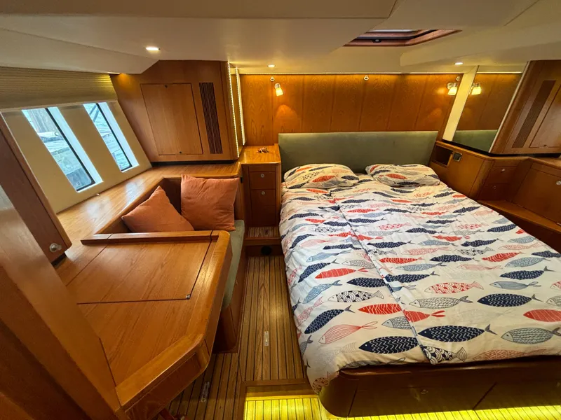 Slide: The Image of Luxurious cabin interior of 2014 Southerly 535 yacht with cozy bed and wooden furnishings. - 39