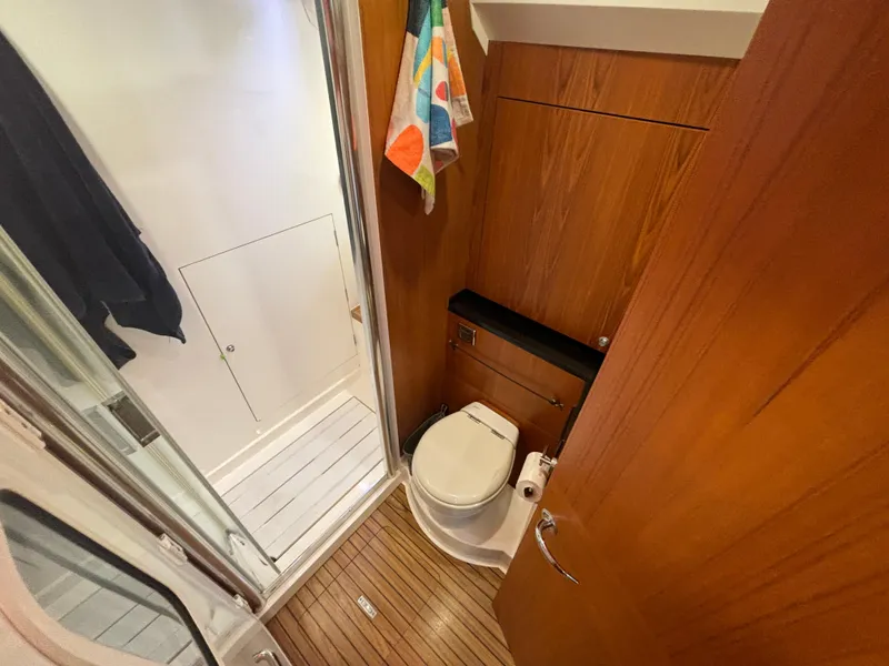 Slide: The Image of Bathroom interior of 2014 Southerly 535 yacht with wooden paneling and modern fixtures. - 41