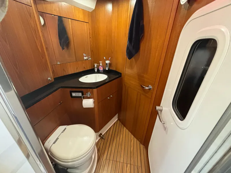 Slide: The Image of Luxurious 2014 Southerly 535 yacht bathroom with wood paneling and modern fixtures. - 44