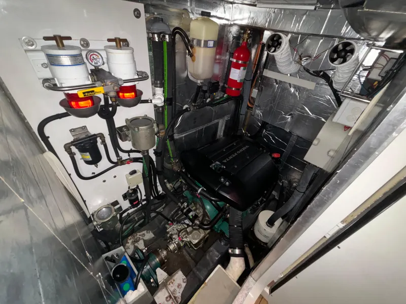 Slide: The Image of Engine room of a 2014 Southerly 535 yacht, featuring mechanical components and safety equipment. - 46