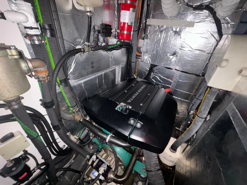 Slide: The Image of Engine room of 2014 Southerly 535 yacht with Volvo Penta engine and fire extinguisher. - 47