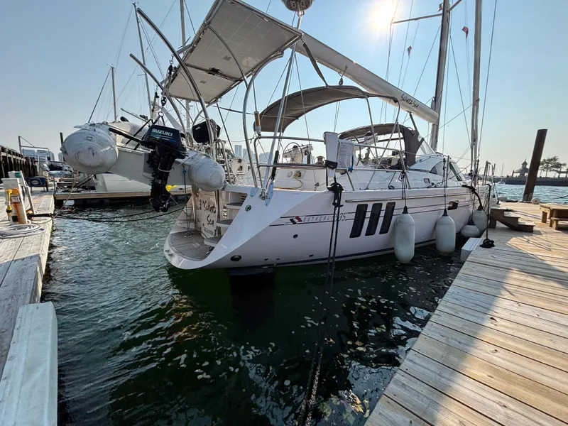 Slide: The Image of Sailing yacht Southerly 535, 2014 model, docked at marina with inflatable dinghy. - 7