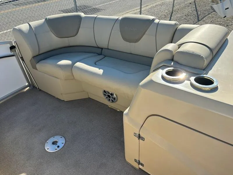 Slide: The Image of Luxurious seating area on a 2018 Sylvan S3 boat with cup holders and speaker. - 11