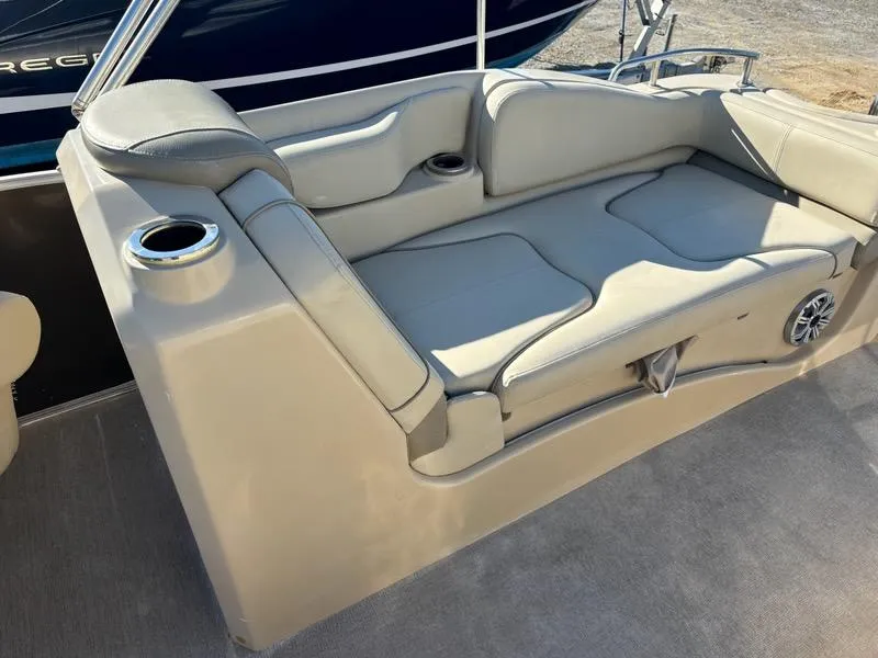 Slide: The Image of 2018 Sylvan S3 boat seating area with cup holders and speaker. - 12