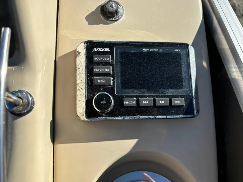 Slide: The Image of Kicker media center on 2018 Sylvan S3 boat dashboard, featuring control buttons. - 9