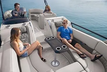 Slide: The Image of 2020 Bennington 24RTSBA pontoon boat with passengers relaxing on comfortable seating. - 10