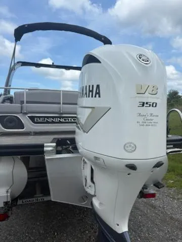 Slide: The Image of 2020 Bennington 24RTSBA boat with Yamaha V8 350 engine, parked outdoors. - 14