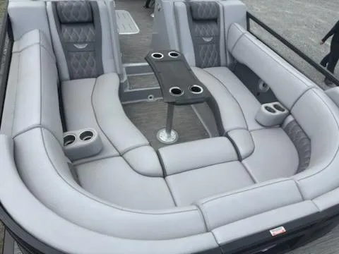 Slide: The Image of Luxurious seating on a 2020 Bennington 24RTSBA pontoon boat with cup holders and table. - 15