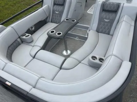 Slide: The Image of Luxurious seating on a 2020 Bennington 24RTSBA pontoon boat with cup holders and table. - 16