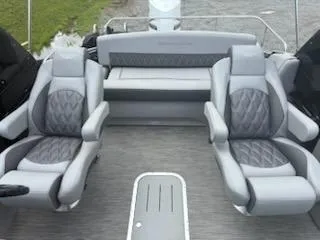 Slide: The Image of 2020 Bennington 24RTSBA boat interior with gray seating and modern design. - 17