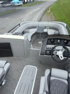 Slide: The Image of 2020 Bennington 24RTSBA pontoon boat interior with plush seating and modern dashboard. - 18