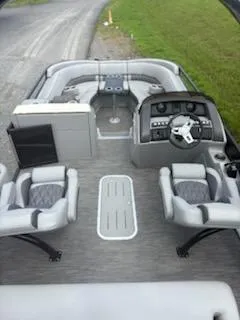 Slide: The Image of 2020 Bennington 24RTSBA pontoon boat interior with modern seating and steering console. - 21