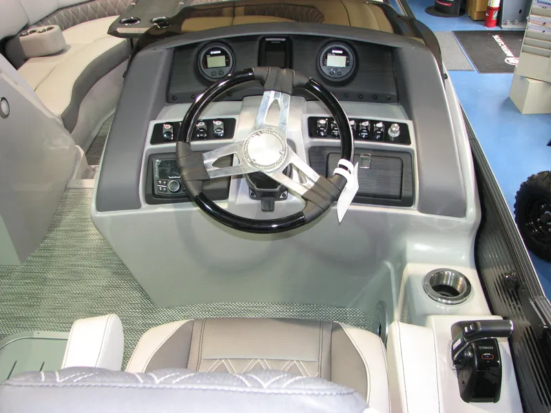 Slide: The Image of 2020 Bennington 24RTSBA boat dashboard with steering wheel and control panel. - 4