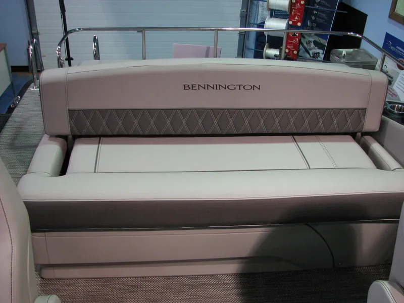 Slide: The Image of 2020 Bennington 24RTSBA boat interior with cushioned seating and elegant design. - 7