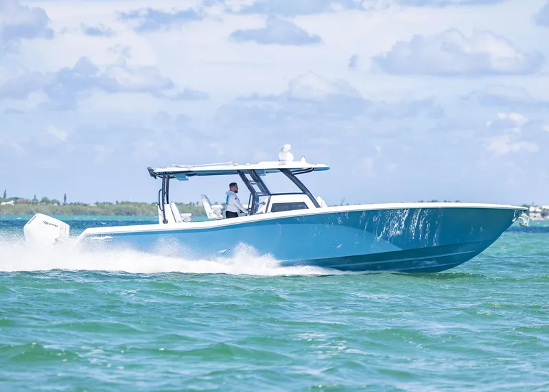 Slide: The Image of 2025 Invincible 43 Open Fisherman cruising on clear blue waters. - 3