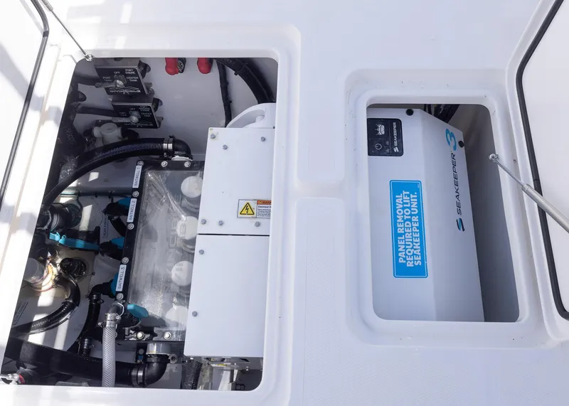 Slide: The Image of 2025 Invincible 43 Open Fisherman boat engine compartment with Seakeeper 3 stabilization system. - 32
