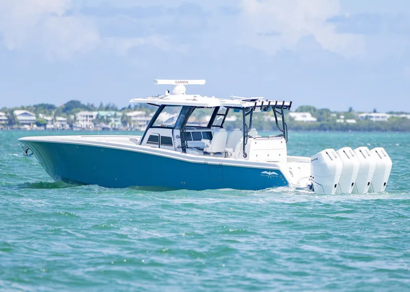 Slide: The Image of 2025 Invincible 43 Open Fisherman boat cruising on clear blue water. - 39