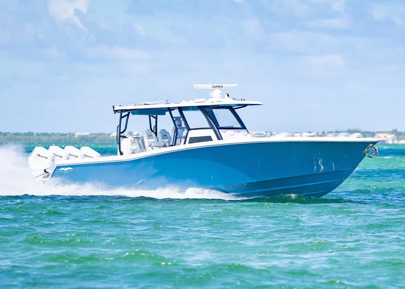 Slide: The Image of 2025 Invincible 43 Open Fisherman boat cruising on clear blue water. - 4