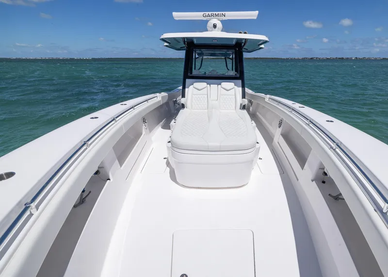 Slide: The Image of 2025 Invincible 43 Open Fisherman boat on open water, featuring sleek design and advanced Garmin technology. - 9