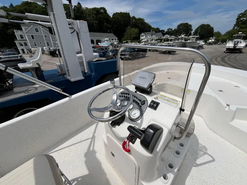 Slide: The Image of 2013 Carolina Skiff 178 DLV boat console with steering wheel and Garmin device. - 13