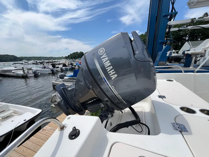 Slide: The Image of 2013 Carolina Skiff 178 DLV with Yamaha outboard motor at marina dock. - 17