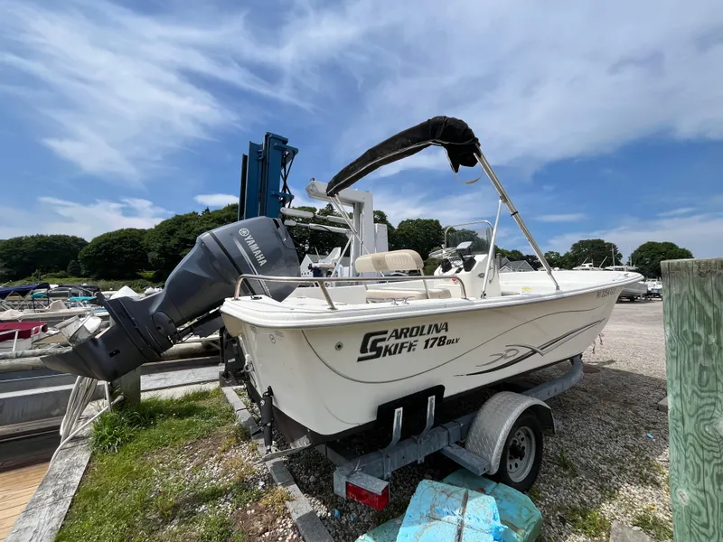 Slide: The Image of 2013 Carolina Skiff 178 DLV boat on trailer with Yamaha outboard motor. - 4