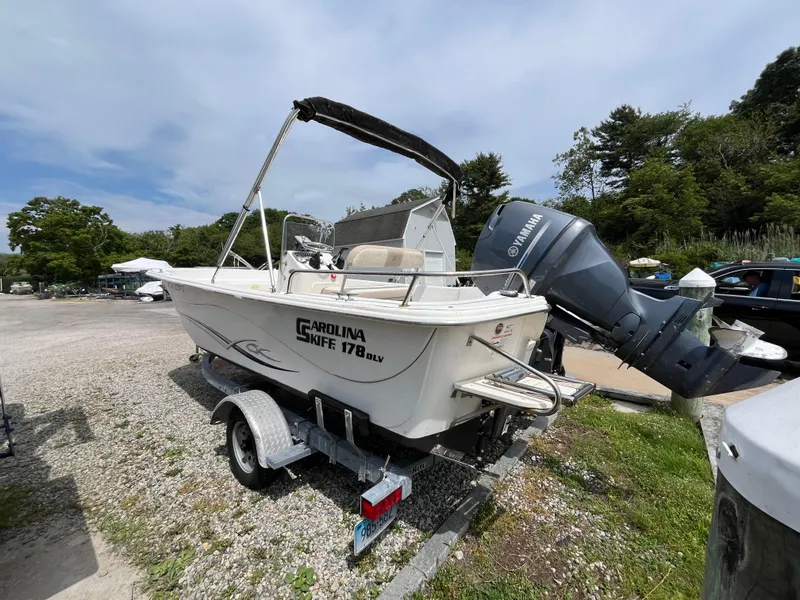 Slide: The Image of 2013 Carolina Skiff 178 DLV boat on trailer with Yamaha outboard motor. - 7