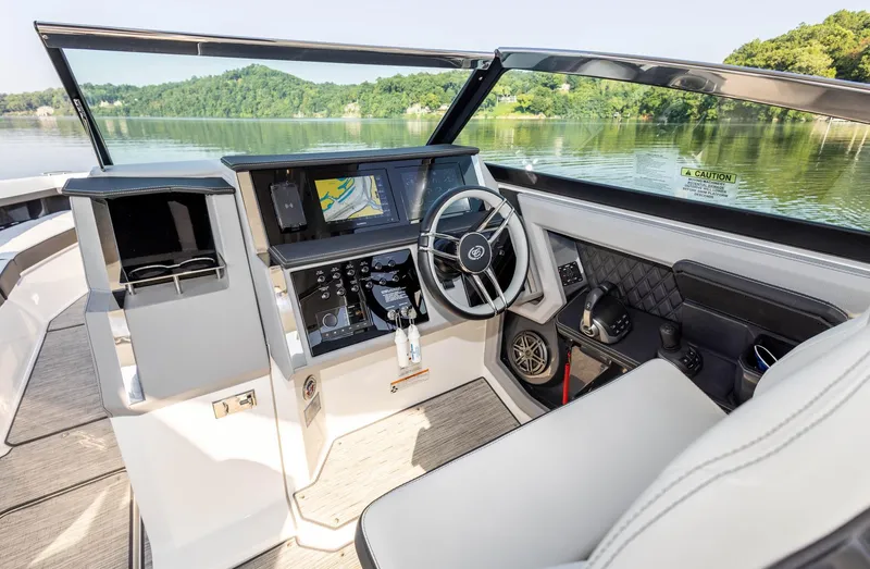 Slide: The Image of Interior of 2023 Cobalt R33 boat with modern dashboard and steering wheel. - 21