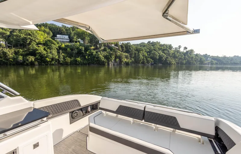 Slide: The Image of Luxury Cobalt R33 boat interior with scenic lake view, 2023 model. - 24