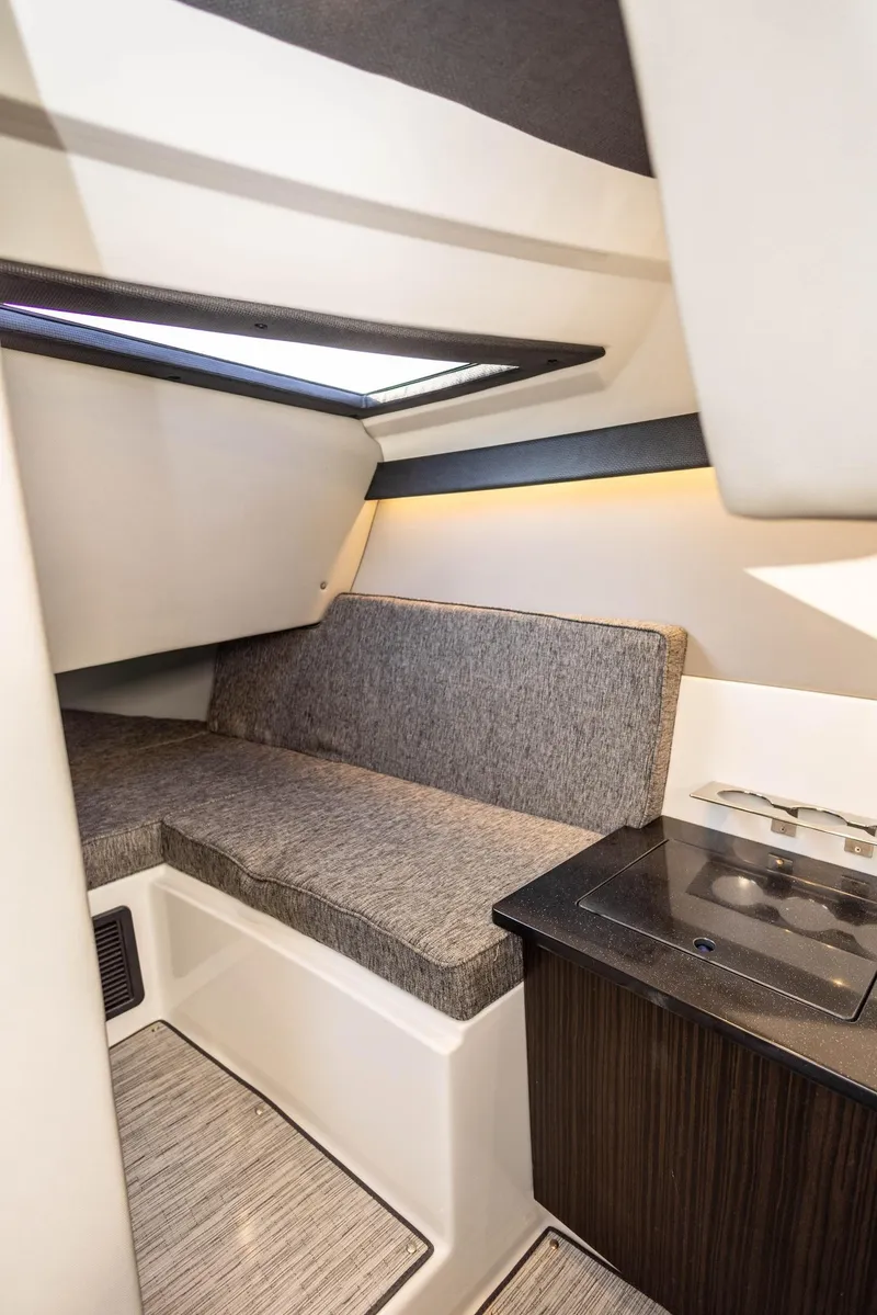 Slide: The Image of 2023 Cobalt R33 interior cabin with seating and kitchenette. - 25