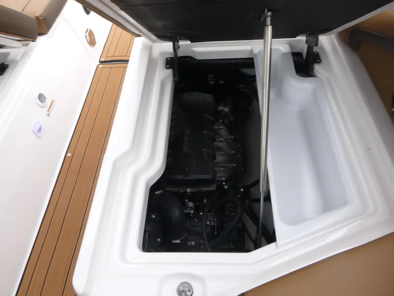 Slide: The Image of 2025 Yamaha Boats 275 SD engine compartment with open hatch, showcasing interior mechanics. - 16