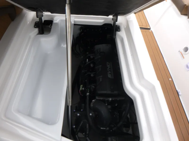 Slide: The Image of 2025 Yamaha Boats 275 SD engine compartment with open hatch, showcasing internal components. - 17