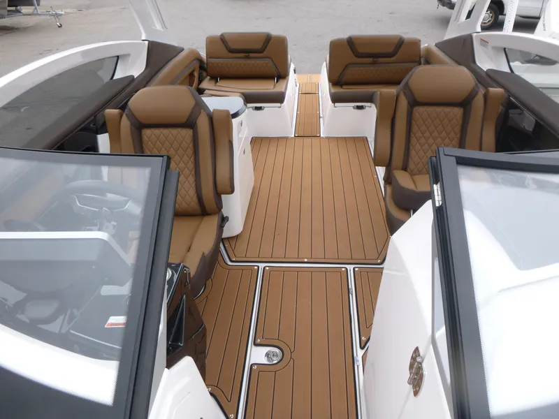 Slide: The Image of Luxurious interior of 2025 Yamaha Boats 275 SD with brown leather seating and sleek design. - 4