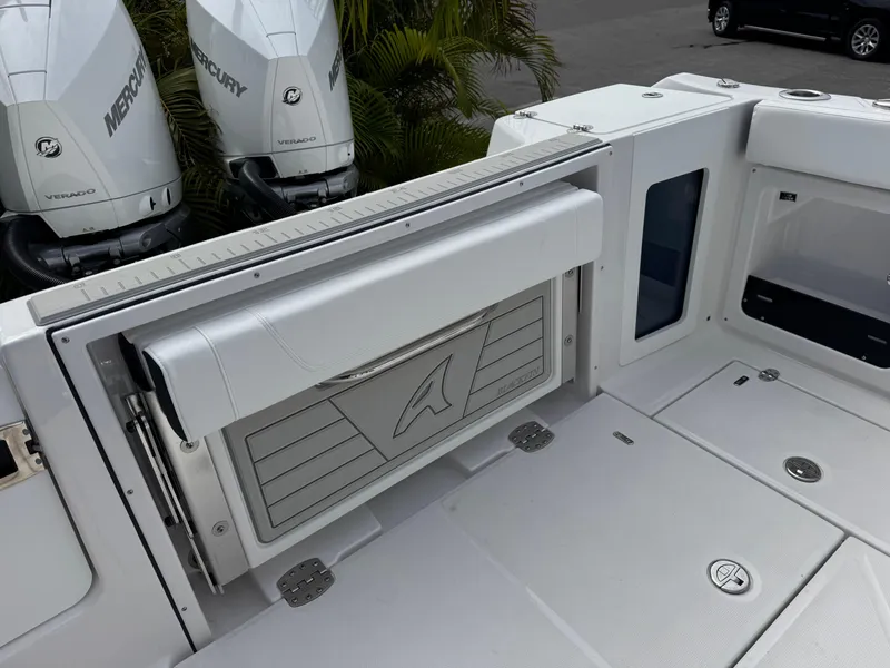 Slide: The Image of 2026 Blackfin 302 DC boat deck with Mercury Verado engines, featuring sleek design and storage compartments. - 13