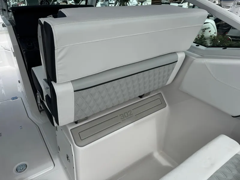Slide: The Image of 2026 Blackfin 302 DC boat interior with sleek, modern seating design. - 16