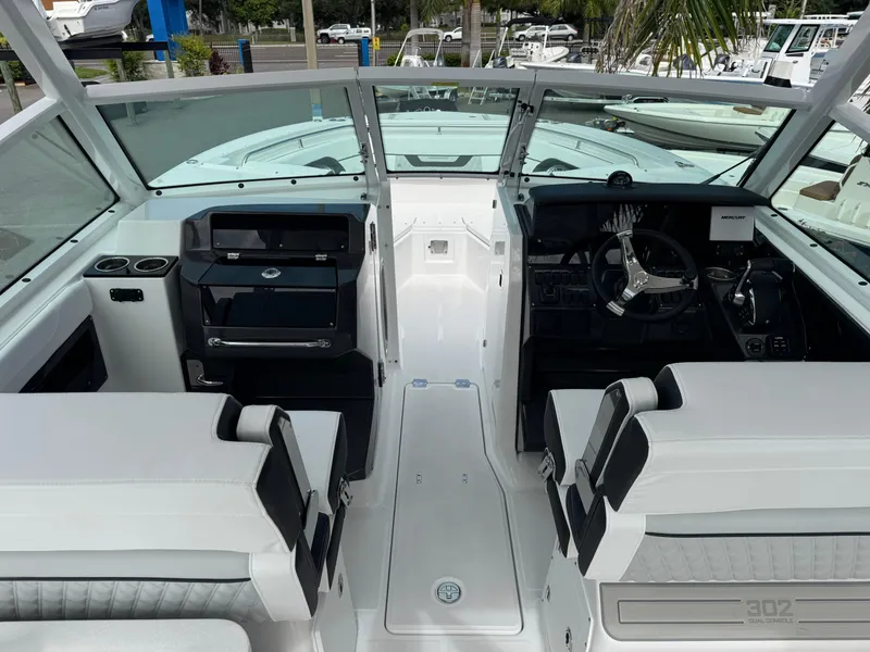 Slide: The Image of 2026 Blackfin 302 DC boat interior with modern helm and seating. - 17