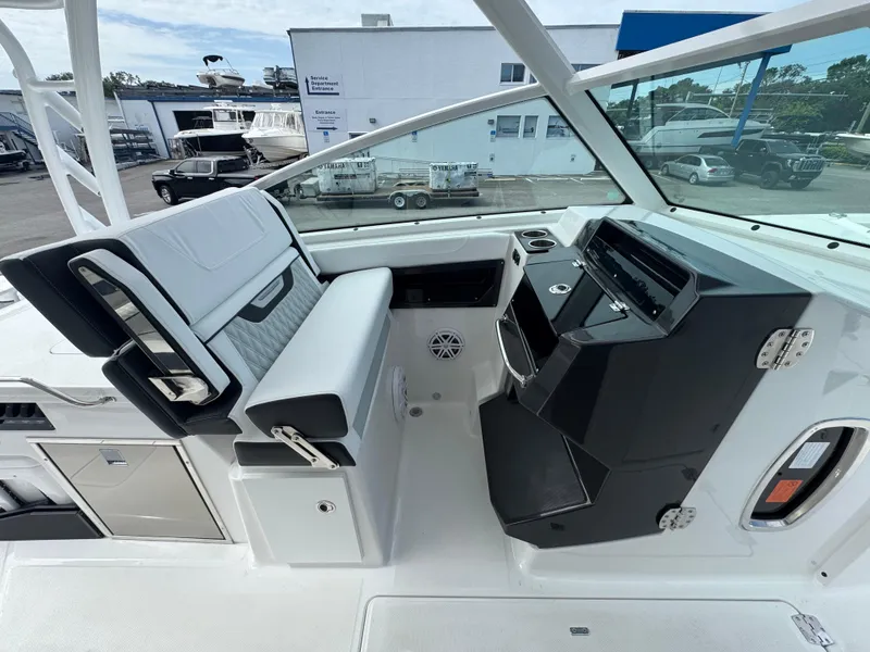 Slide: The Image of 2026 Blackfin 302 DC boat interior with modern seating and control panel. - 23