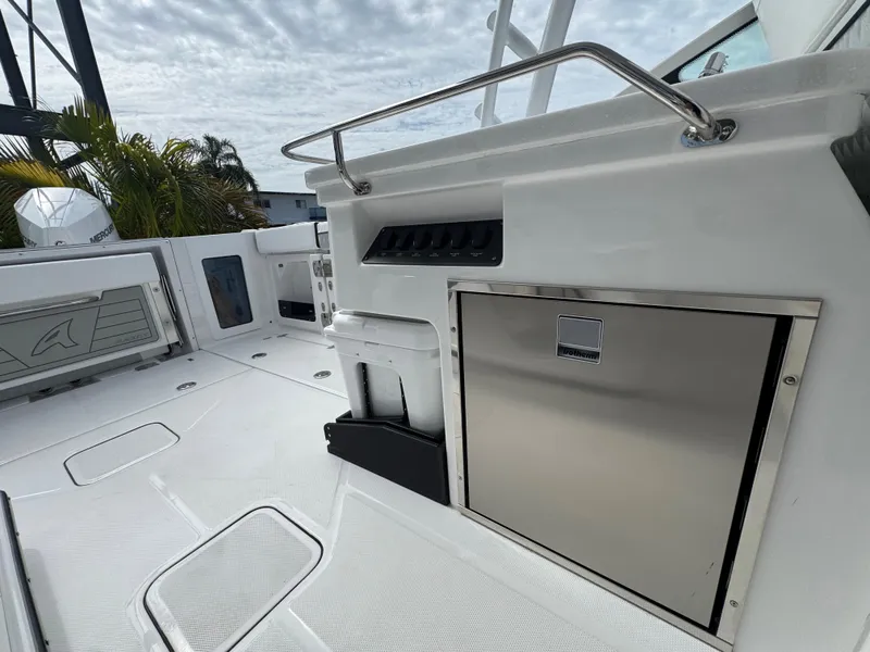 Slide: The Image of 2026 Blackfin 302 DC boat deck with stainless steel features and storage compartments. - 24