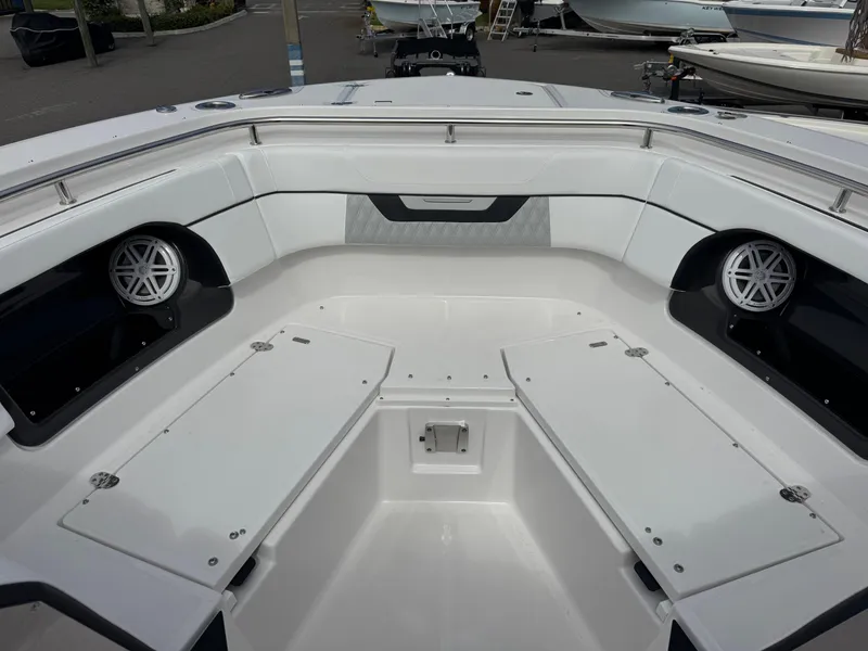Slide: The Image of 2026 Blackfin 302 DC boat interior with seating and speakers. - 26