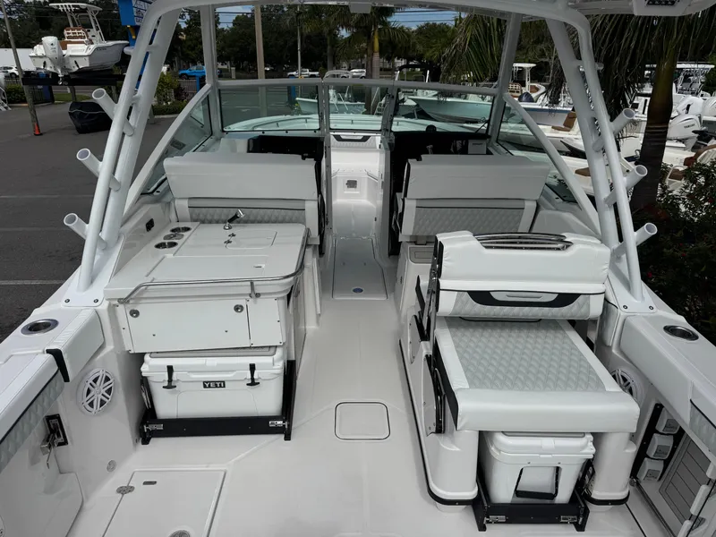 Slide: The Image of 2026 Blackfin 302 DC boat interior with seating and storage, featuring modern design elements. - 9