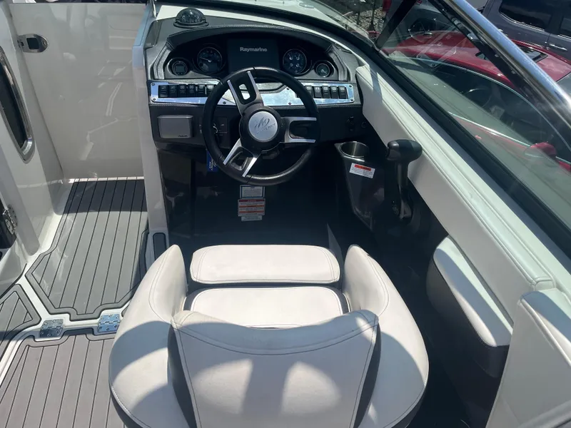 Slide: The Image of 2014 Monterey 268SS Bowrider cockpit with steering wheel and dashboard controls. - 10
