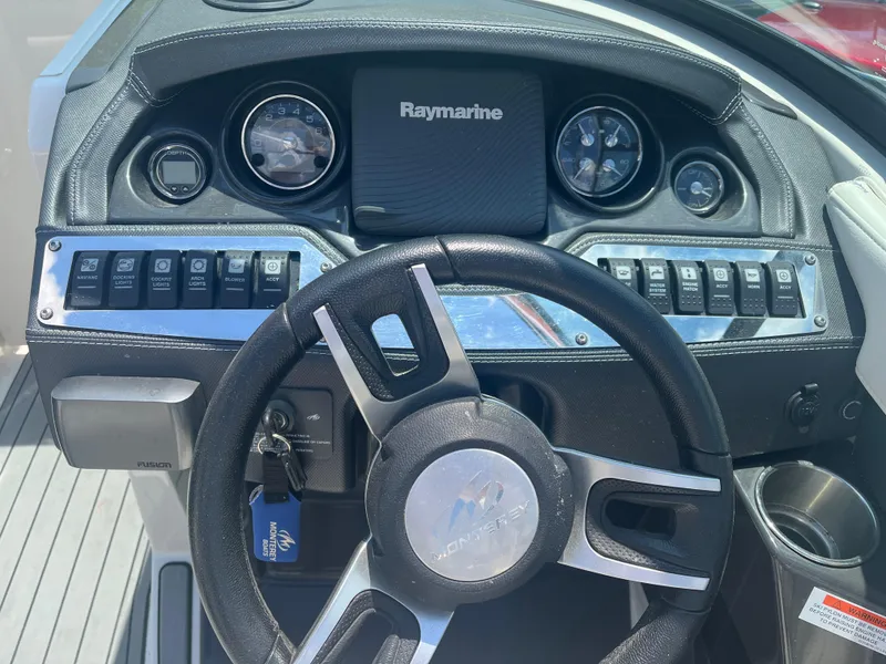 Slide: The Image of Dashboard of a 2014 Monterey 268SS Bowrider with Raymarine display and controls. - 12