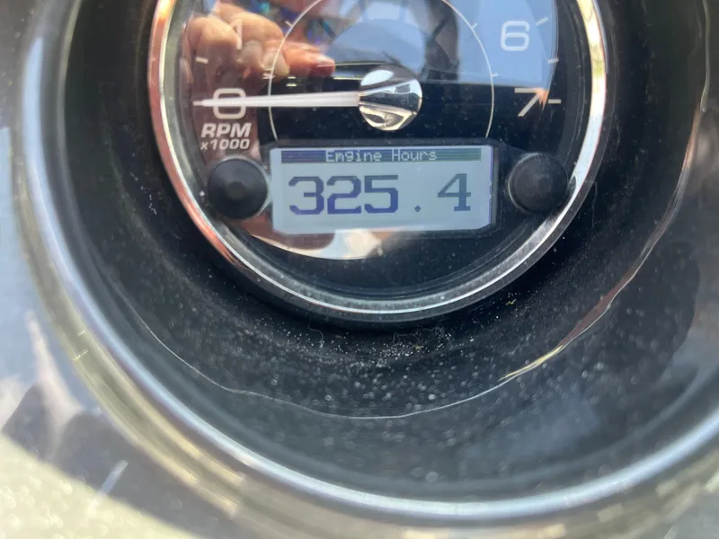 Slide: The Image of Close-up of a 2014 Monterey 268SS Bowrider engine hour meter showing 325.4 hours. - 14