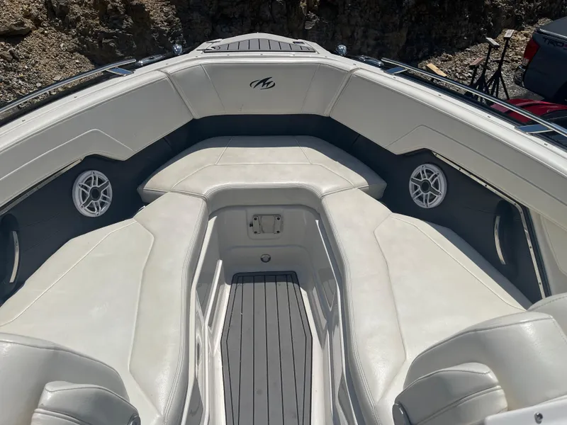Slide: The Image of 2014 Monterey 268SS Bowrider interior with white seating and built-in speakers. - 15