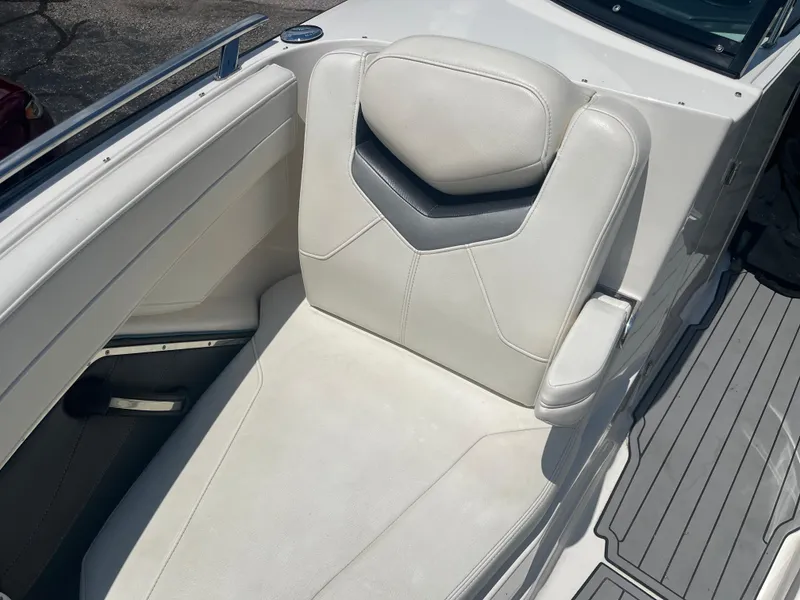 Slide: The Image of 2014 Monterey 268SS Bowrider boat seat with white upholstery and armrest. - 16